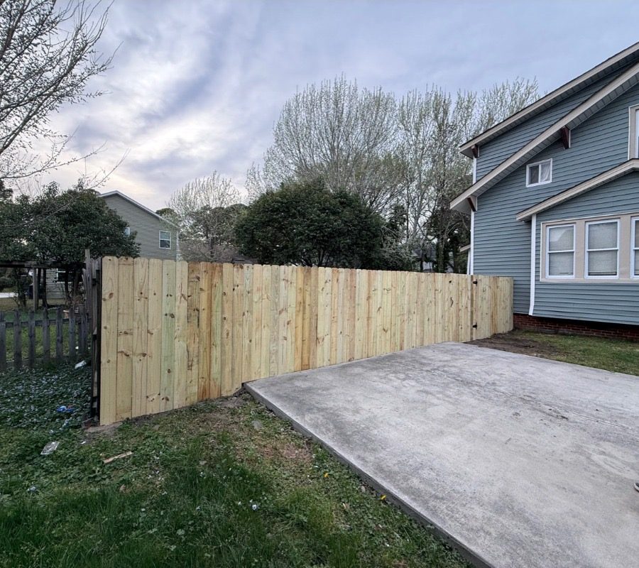 Privacy fence and patio after, by Mend Renovations